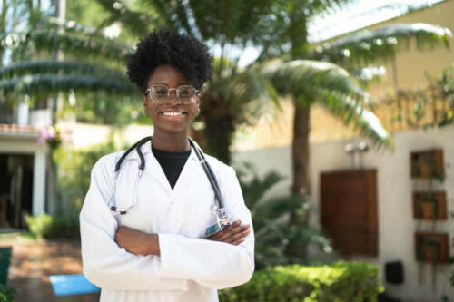 Portrait of smiling and young home caregiver