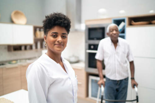 Portrait of a caretaker and patient in the background