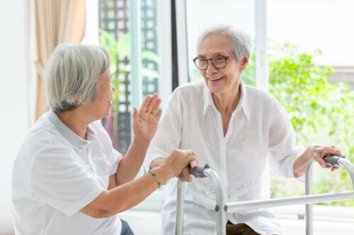 happy-two-asian-senior-women-friends-holding-hands-care-support-fun-talking-time-together-old-people-smiling-walker-148623471